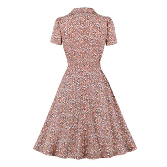 Vintage polka dot women's floral print A-line midi dress with short sleeves and a round neck, featuring a peach-colored floral pattern.