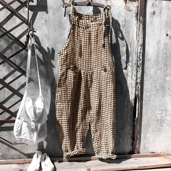 Vintage striped blue and white dungarees hanging on a clothes hanger, featuring a retro jumpsuit overall style with an orange variant in 3XL size.
