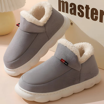 Warm fleece-lined winter slippers for women with a plush collar in gray, featuring a soft and cozy design.