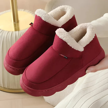 Warm fleece-lined winter slippers for women with a plush collar in a vibrant red color, shown in size 46-47, designed for comfort and style.