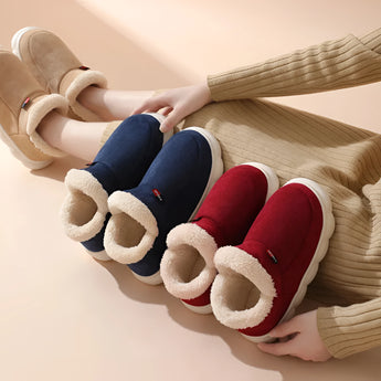 Warm fleece-lined winter slippers for women with a plush collar, featuring a cozy woolen texture and stylish design.