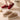 Warm fleece-lined winter slippers for women featuring a plush collar, in shades of pink and white, designed for comfort and style.