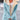 Gray winter jacket for women with sherpa lining, featuring long sleeves and a collar, designed for warmth and style. The jacket is displayed in a blue color variant, size 4XL.