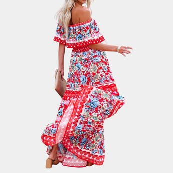 Elegant red floral silk maxi dress with watercolor design, featuring a sleeveless shoulder cut, fitted waistline, and flowing skirt, ideal for spring and summer formal occasions.