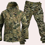 Waterproof hooded tactical jacket and cargo pants set in camouflage pattern, featuring durable outerwear design with long sleeves and a collar, suitable for outdoor activities.