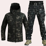 Waterproof hooded tactical jacket and cargo pants set in camouflage pattern, featuring durable material and designed for outdoor activities. The jacket includes a high collar and long sleeves, suitable for workwear and fashion purposes.