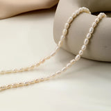 Waterproof hypoallergenic pearl choker necklace showcased on a neck, featuring elegant beach jewelry design with natural materials.