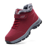Waterproof insulated fur-lined winter hiking boots designed for outdoor activities, featuring a sturdy sole and durable materials suitable for sportswear and walking in wet conditions.