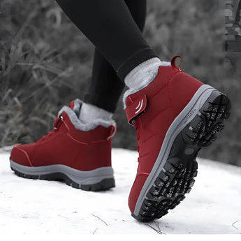 Red waterproof insulated fur-lined winter hiking boots in size 45, designed for outdoor activities with durable construction and stylish detailing.
