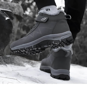 Gray waterproof insulated fur-lined winter hiking boots in size 45 designed for outdoor activities, featuring a durable construction suitable for cold weather and walking on various terrains.