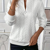 White cable knit zip-up sweater featuring long sleeves and a stylish design, suitable for women's autumn fashion.