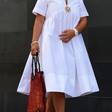 White empire waist maternity dress featuring a V-neckline and short sleeves, designed for summer wear, shown in size 3XL.