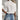 White floral embroidered lace blouse with sheer fabric, featuring short sleeves and a round neckline.