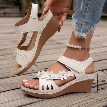 White floral wedge sandals featuring a beaded strap and intricate cutout design, shown in size 43.
