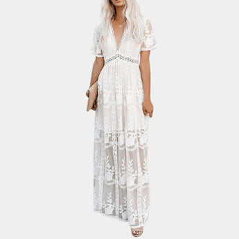 White lace maxi dress with a bohemian V-neckline and flowing silhouette, suitable for a beach wedding, in size XL.