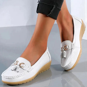 White leather tassel loafers for women, designed as comfortable casual slip-ons, shown in the color white, size 44.