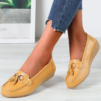 White leather tassel loafers for women in a vibrant yellow color, shown in size 44. These comfortable casual slip-on shoes feature a sleek design, suitable for everyday wear.