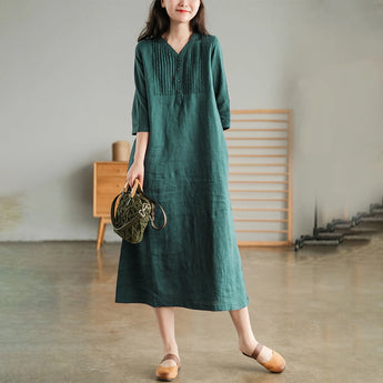 Green 3XL white linen midi dress featuring a V-neckline, pleated detailing, and long sleeves. The dress falls to knee length, with a focus on sustainable textile material.