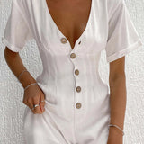 White linen mini dress with short sleeves, a collar, and a fitted waist, displayed on a hanger.