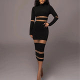 
A woman wearing a white long sleeve bodycon dress featuring sheer panels and striped detailing, styled in a midi length.