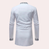 White long-sleeve men's shirt featuring embroidered cuffs and a patterned collar.