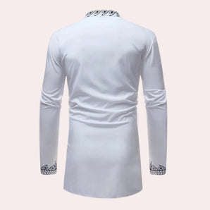 White long-sleeve men's shirt featuring embroidered cuffs and a patterned collar.