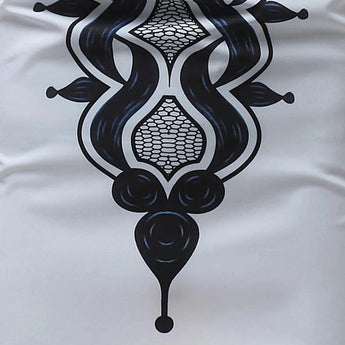 White long-sleeve men's shirt featuring intricately embroidered cuffs and a patterned collar, highlighted with artistic and symmetrical designs.