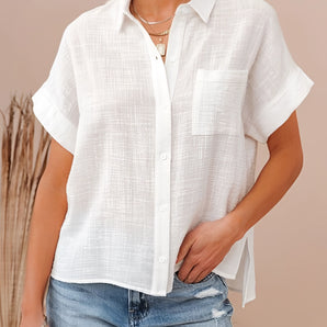 White loose fit women's summer linen shirt with short sleeves, designed for a casual look. The shirt features a classic collar and is made from lightweight linen material, perfect for warm weather.