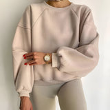 White puff-sleeve crew neck sweatshirt in beige, featuring a modern streetwear fashion style, shown in XXL size with visible shoulder and arm details.