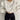 White puff-sleeve crew neck sweatshirt in size XXL, showcasing modern streetwear fashion with its spacious sleeves and clean white textile.