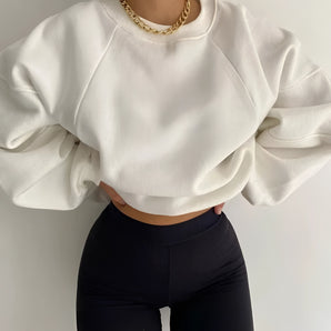 White puff-sleeve crew neck sweatshirt in size XXL, showcasing modern streetwear fashion with its spacious sleeves and clean white textile.