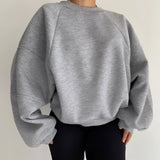 Gray XXL white puff-sleeve crew neck sweatshirt designed for modern streetwear fashion, showcasing the garment's outerwear style with emphasis on the neck, sleeves, and waist areas.
