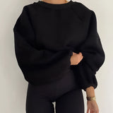Black puff-sleeve crew neck sweatshirt in an XXL size, showcasing modern streetwear fashion with distinct sleeve detailing and a relaxed fit around the waist.