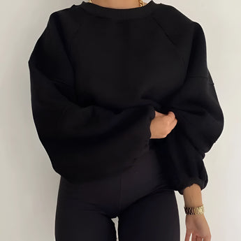 Black puff-sleeve crew neck sweatshirt in an XXL size, showcasing modern streetwear fashion with distinct sleeve detailing and a relaxed fit around the waist.