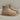 Khaki white quilted insulated lightweight winter snow boots displayed on a wooden surface, showcasing their comfort and outdoor utility features.