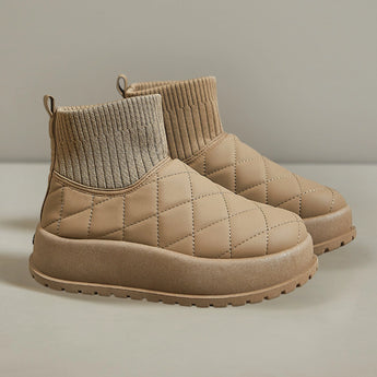 Khaki white quilted insulated lightweight winter snow boots displayed on a wooden surface, showcasing their comfort and outdoor utility features.