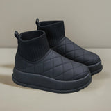 Black quilted insulated lightweight winter snow boots for outdoor activities, featuring a synthetic rubber sole for comfort and durability.