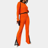 Unisex white ribbed knit top featuring a green collar, styled as a spring sweater, shown in orange color, size L.