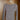 
Gray ribbed scoop neck long sleeve bodysuit on clothes hanger, showcasing neckline and sleeve design.