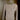 White ribbed scoop neck long sleeve bodysuit in khaki on clothes hanger, showcasing its beige color and soft textile with fashion-forward design, tailored for women's fashion in size XL.