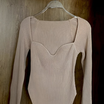 White ribbed scoop neck long sleeve bodysuit in khaki on clothes hanger, showcasing its beige color and soft textile with fashion-forward design, tailored for women's fashion in size XL.