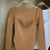 White ribbed scoop neck long sleeve bodysuit in brown color, displayed on a clothes hanger against a simple background, showcasing its stylish design and texture, suitable for women's fashion in XL size.