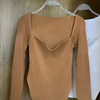 White ribbed scoop neck long sleeve bodysuit in brown color, displayed on a clothes hanger against a simple background, showcasing its stylish design and texture, suitable for women's fashion in XL size.