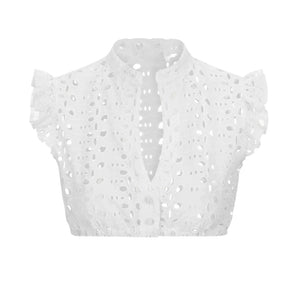 White sleeveless eyelet blouse with ruffled details and a collar in size XL.