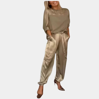 Women's white satin jumpsuit and khaki cargo pants set featuring a collared design with pockets and a fashion-forward appeal, modeled by a woman wearing 2XL in a stylish loungewear ensemble.