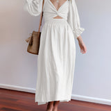 White V-neck midi dress featuring balloon sleeves, designed in a boho chic style.