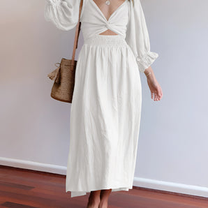 White V-neck midi dress featuring balloon sleeves, designed in a boho chic style.
