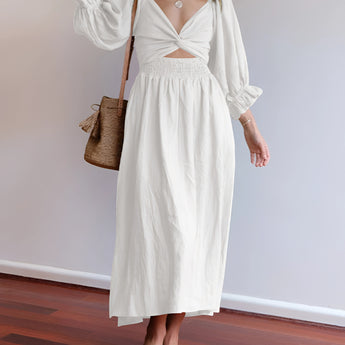 White V-neck midi dress featuring balloon sleeves, designed in a boho chic style.