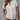 White V-neck short sleeve blouse for women, featuring elegant summer office wear design.