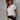 White V-neck short sleeve blouse in a 5XL size, designed for elegant women's summer office wear, showcased with fashion accessories like sunglasses.